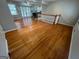 Spacious living room featuring hardwood floors, large windows, and French doors at 1329 Springwood Nw Dr, Conyers, GA 30012