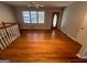 Inviting living room showcasing polished hardwood floors and natural light at 1329 Springwood Nw Dr, Conyers, GA 30012