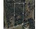 Aerial view of property boundaries and surroundings including forest areas, roads and nearby houses at 712 Honeysuckle Ln, Temple, GA 30179