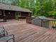 Large deck with outdoor seating provides a private and relaxing place to unwind at 712 Honeysuckle Ln, Temple, GA 30179