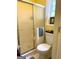 Bathroom featuring a shower stall with glass doors, toilet, and a sink vanity at 712 Honeysuckle Ln, Temple, GA 30179