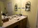 Well-lit bathroom featuring a vanity with ample countertop space, and decorative accents for a personal touch at 712 Honeysuckle Ln, Temple, GA 30179