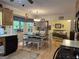 The kitchen has a large table and flows into the living room, creating a social space at 712 Honeysuckle Ln, Temple, GA 30179