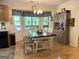 Eat-in kitchen features a large window and a wood table with seating for Gathering meals at 712 Honeysuckle Ln, Temple, GA 30179