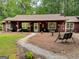 Charming single-story home with inviting front porch, swing and gravel pathway at 712 Honeysuckle Ln, Temple, GA 30179