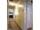 Hallway with neutral colored walls leading to various rooms in the home at 712 Honeysuckle Ln, Temple, GA 30179