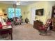 Cozy living room provides natural light from a large window, comfortable furniture, and a relaxing atmosphere at 712 Honeysuckle Ln, Temple, GA 30179