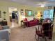Inviting living room features a doorway into the kitchen, warm colors, and cozy seating arrangement at 712 Honeysuckle Ln, Temple, GA 30179