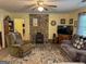 Cozy living room features a stone fireplace with wood stove, perfect for relaxing at 712 Honeysuckle Ln, Temple, GA 30179