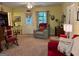 Inviting living room featuring comfortable seating, natural light, and neutral color scheme at 712 Honeysuckle Ln, Temple, GA 30179