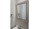Well-lit bathroom featuring a stylish framed mirror, towel ring, and modern faucet at 1607 Hillview Ave, Jonesboro, GA 30236