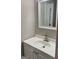 Bathroom featuring a white vanity with sink and decorative mirror at 1607 Hillview Ave, Jonesboro, GA 30236