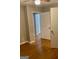 Bedroom with hardwood flooring and access to multiple rooms at 1607 Hillview Ave, Jonesboro, GA 30236