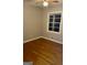 Bedroom features beautiful hardwood floors and a ceiling fan at 1607 Hillview Ave, Jonesboro, GA 30236