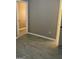 View of neutral bedroom from the doorway, showing modern flooring and an open doorway at 1607 Hillview Ave, Jonesboro, GA 30236