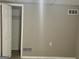 Clean bedroom features neutral wall color, white trim, and a closet with ample storage at 1607 Hillview Ave, Jonesboro, GA 30236