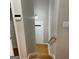 View of an entryway with a hardwood staircase and a white front door at the end of the hall at 1607 Hillview Ave, Jonesboro, GA 30236