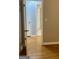 Hallway with hardwood floors and multiple doors to other rooms at 1607 Hillview Ave, Jonesboro, GA 30236