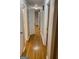 Hallway view showcasing hardwood floors and neutral wall color at 1607 Hillview Ave, Jonesboro, GA 30236