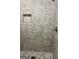 This bathroom features a shower with marble-look tile and a shower niche for storage at 1607 Hillview Ave, Jonesboro, GA 30236