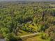 Aerial view showing a beautiful house on a large lot surrounded by lush greenery at 292 S Prospect Ave, Waco, GA 30182