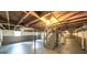 Unfinished basement with exposed ceiling, concrete floor, and staircase at 292 S Prospect Ave, Waco, GA 30182