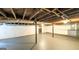 Spacious unfinished basement with exposed ceiling and updated walls at 292 S Prospect Ave, Waco, GA 30182
