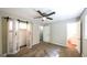 A comfortable bedroom boasts carpet floors, a ceiling fan, and a sliding closet door at 292 S Prospect Ave, Waco, GA 30182