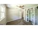 This comfortable bedroom features a carpeted floor and decorative sliding closet door at 292 S Prospect Ave, Waco, GA 30182