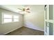Bedroom featuring plush carpeting, a window, and a sliding closet door at 292 S Prospect Ave, Waco, GA 30182