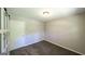 Neutral bedroom featuring carpet floors, closet with sliding barn door and ample natural light at 292 S Prospect Ave, Waco, GA 30182