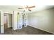 This bedroom features carpet flooring and a white sliding closet door at 292 S Prospect Ave, Waco, GA 30182