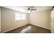 Bedroom with neutral walls, carpet flooring, a window, and a ceiling fan at 292 S Prospect Ave, Waco, GA 30182