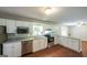 Bright kitchen features stainless steel appliances, granite countertops, and white cabinets at 292 S Prospect Ave, Waco, GA 30182