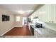 Stylish kitchen with granite countertops, stainless steel appliances, and wood-look flooring at 292 S Prospect Ave, Waco, GA 30182