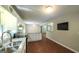 Well-lit kitchen boasting granite countertops, stainless appliances, and ample cabinet space at 292 S Prospect Ave, Waco, GA 30182