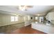 Bright living area with a smooth transition to the modern kitchen and lots of natural light at 292 S Prospect Ave, Waco, GA 30182