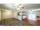 Living area leading into the kitchen featuring a breakfast bar and access to the backyard at 292 S Prospect Ave, Waco, GA 30182