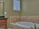 Bathroom highlighting a soaking tub with tile surround and fixtures at 834 Chalet Hills, Mcdonough, GA 30253