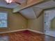 Bedroom with hardwood flooring, angled ceiling, and light green walls at 834 Chalet Hills, Mcdonough, GA 30253