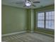 Bedroom with neutral carpet, green walls, and a ceiling fan at 834 Chalet Hills, Mcdonough, GA 30253