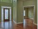 Spacious entryway with hardwood floors and detailed woodwork, leading to other rooms in the home at 834 Chalet Hills, Mcdonough, GA 30253
