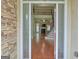 Elegant foyer boasting gleaming hardwood floors, a wrought iron staircase, and an open view to the living area at 834 Chalet Hills, Mcdonough, GA 30253