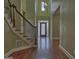 Inviting foyer features a decorative glass front door, chandelier, staircase, and hardwood floors at 834 Chalet Hills, Mcdonough, GA 30253