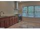 Well-lit kitchen featuring stainless steel appliances, ample counter space, and a large window at 834 Chalet Hills, Mcdonough, GA 30253