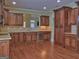 Charming kitchen with granite countertops, stainless steel appliances, and beautiful hardwood floors at 834 Chalet Hills, Mcdonough, GA 30253