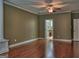 Spacious living room with hardwood floors, neutral walls, and access to the bathroom at 834 Chalet Hills, Mcdonough, GA 30253