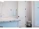 Powder room featuring a granite countertop, white cabinets, and access to the toilet at 368 Ginger Cake Rd, Fayetteville, GA 30214