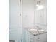 Bathroom featuring a granite vanity, a mirror, and a hand towel, providing an efficient use of space at 368 Ginger Cake Rd, Fayetteville, GA 30214