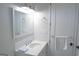 Clean, white bathroom with vanity, chrome fixtures, a large mirror, and fresh towels at 368 Ginger Cake Rd, Fayetteville, GA 30214